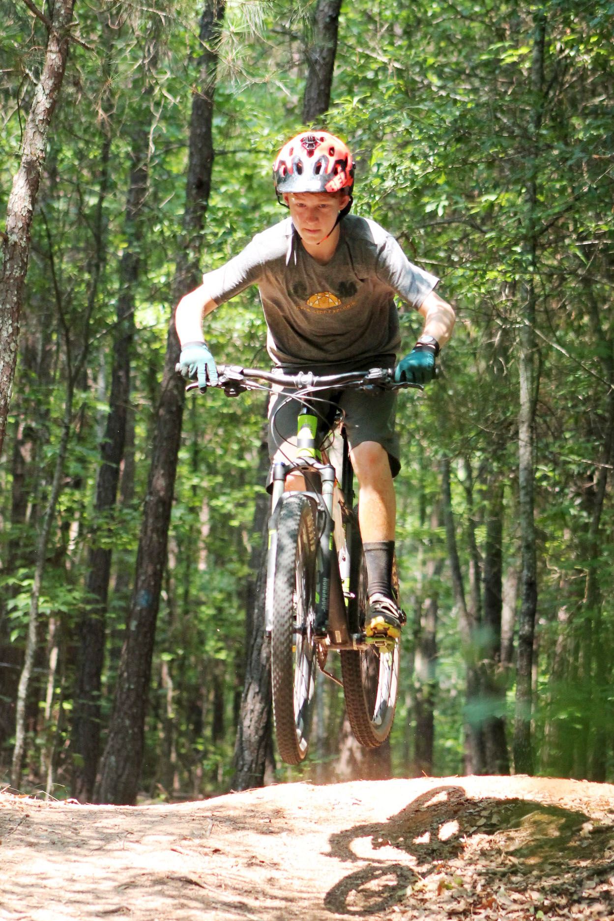 Mountain Biker Jumping Hill